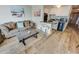 Cozy living area featuring modern flooring, comfortable seating, and an efficient kitchenette at 2310 N Ocean Blvd. # 308, Myrtle Beach, SC 29572
