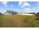 Expansive backyard with a white picket fence, perfect for outdoor activities and privacy at 237 Copperwood Loop, Conway, SC 29526