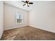 Bedroom with neutral carpet and paint and a large window for lots of natural light at 237 Copperwood Loop, Conway, SC 29526