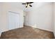 Bright bedroom featuring neutral walls, plush carpet, and a ceiling fan at 237 Copperwood Loop, Conway, SC 29526