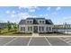 Charming community clubhouse with ample parking and well-maintained landscaping at 237 Copperwood Loop, Conway, SC 29526