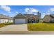 Charming single-story home with a well-manicured lawn and inviting front entrance at 237 Copperwood Loop, Conway, SC 29526