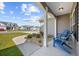 Inviting front porch with cozy seating and landscaped garden, perfect for relaxing at 237 Copperwood Loop, Conway, SC 29526