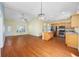 Open kitchen and living room features wood flooring, granite countertops and stainless appliances at 237 Copperwood Loop, Conway, SC 29526
