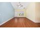 Bright, open living area with wood floors, a ceiling fan, and a large window at 237 Copperwood Loop, Conway, SC 29526