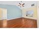 Spacious living room with wood flooring, lots of natural light, and access to the bathroom at 237 Copperwood Loop, Conway, SC 29526