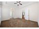 Spacious main bedroom with neutral walls, plush carpet, and a ceiling fan at 237 Copperwood Loop, Conway, SC 29526
