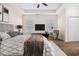 Staged main bedroom with carpet flooring, ceiling fan, and lots of natural light at 237 Copperwood Loop, Conway, SC 29526