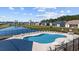 Sparkling community pool overlooking a serene pond, offering a relaxing atmosphere for residents at 237 Copperwood Loop, Conway, SC 29526