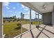 Relaxing screened-in porch provides a seamless transition to the outdoors and views of the manicured lawn at 237 Copperwood Loop, Conway, SC 29526