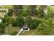 Aerial view showing house, overgrown backyard and in-ground pool in disrepair at 2560 Wise Rd., Conway, SC 29526