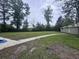 Backyard lot with open space and utility shed, presenting opportunities for outdoor activities and storage solutions at 2560 Wise Rd., Conway, SC 29526