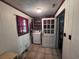 Functional laundry room with washer, dryer, and storage shelves at 2560 Wise Rd., Conway, SC 29526