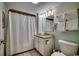 Neat bathroom with vanity, toilet, shower with curtain, and light green walls at 2711 S Ocean Blvd. # 1917, North Myrtle Beach, SC 29582