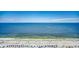 Picturesque beach view with parasail, waves, blue skies, and people enjoying the sun and sand at 2711 S Ocean Blvd. # 1917, North Myrtle Beach, SC 29582