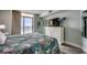 Bright bedroom featuring ocean views, sliding glass doors, and a white dresser with a TV at 2711 S Ocean Blvd. # 1917, North Myrtle Beach, SC 29582