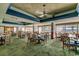 Open dining room with tables and chairs, ceiling fan, and large windows overlooking the ocean at 2711 S Ocean Blvd. # 1917, North Myrtle Beach, SC 29582