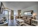 Comfortable living area with a sofa, chairs, and balcony access offering stunning ocean views at 2711 S Ocean Blvd. # 1917, North Myrtle Beach, SC 29582