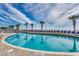 A large, pristine pool with lounge chairs lined along the deck under sunny skies at 2711 S Ocean Blvd. # 1917, North Myrtle Beach, SC 29582