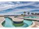 Blue tile lazy river with connected pool and chairs overlooking the beach at 2711 S Ocean Blvd. # 1917, North Myrtle Beach, SC 29582