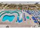 Aerial view of pool and lazy river with lounge chairs and tables with a beach view at 2711 S Ocean Blvd. # 1917, North Myrtle Beach, SC 29582