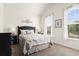 This bedroom features carpet floors, two windows, and neutral-colored walls and decor at 3053 Chesterwood Ct., Myrtle Beach, SC 29579