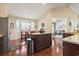 Eat-in kitchen area with breakfast nook and stainless steel refrigerator, hardwood floors, and natural light at 3053 Chesterwood Ct., Myrtle Beach, SC 29579