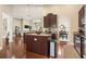 Open kitchen with island, granite countertops, stainless steel appliances, and hardwood floors at 3053 Chesterwood Ct., Myrtle Beach, SC 29579