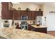 Well-equipped kitchen featuring stainless steel appliances, granite countertops, and a central island at 3053 Chesterwood Ct., Myrtle Beach, SC 29579
