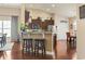 Kitchen with dark wood cabinets, stainless steel appliances, a breakfast bar, and pendant lighting at 3053 Chesterwood Ct., Myrtle Beach, SC 29579