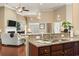 Open concept layout with a kitchen featuring granite counters and a living room with a fireplace at 3053 Chesterwood Ct., Myrtle Beach, SC 29579