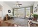 Bright living room with vaulted ceilings, hardwood floors, ceiling fan, and view of the yard at 3053 Chesterwood Ct., Myrtle Beach, SC 29579