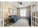 Cozy living room with a comfortable sofa, ceiling fan, and a window with stylish blue curtains at 3053 Chesterwood Ct., Myrtle Beach, SC 29579