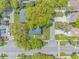 Aerial view of a home and surrounding neighborhood featuring mature trees and well-maintained lawns at 311 Surfside Dr., Surfside Beach, SC 29575