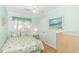 A light and airy bedroom features wood floors and bright decor at 311 Surfside Dr., Surfside Beach, SC 29575