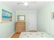 This is a cozy bedroom with light green walls and a ceiling fan at 311 Surfside Dr., Surfside Beach, SC 29575