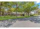 Charming single-story home with metal roof, fenced yard, and well-kept lawn, shaded by mature trees at 311 Surfside Dr., Surfside Beach, SC 29575