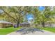 A charming home exterior surrounded by lush greenery, with a spacious yard at 311 Surfside Dr., Surfside Beach, SC 29575