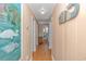 Inviting hallway with wood-look floors and decor, leading to various rooms at 311 Surfside Dr., Surfside Beach, SC 29575