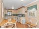 Spacious eat-in kitchen with wood table and chairs, abundant cabinets, and natural light at 311 Surfside Dr., Surfside Beach, SC 29575