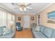 Cozy living room with comfortable seating and a decorative ceiling fan at 311 Surfside Dr., Surfside Beach, SC 29575
