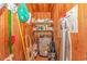 Well-organized utility closet with shelving, water heater, and cleaning supplies at 311 Surfside Dr., Surfside Beach, SC 29575