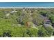 Drone's-eye view of the property surrounded by green trees in the community at 412 43Rd Ave. N, Myrtle Beach, SC 29577