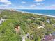 Aerial view showcasing the home's location near beaches, the Atlantic ocean, and mature trees at 412 43Rd Ave. N, Myrtle Beach, SC 29577