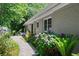 Landscaped backyard showcasing vibrant hydrangea bushes and a serene stone walkway at 412 43Rd Ave. N, Myrtle Beach, SC 29577