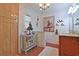 Elegant bathroom with a decorative mannequin, chic art, wood floors and walk-in shower at 412 43Rd Ave. N, Myrtle Beach, SC 29577