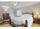 Comfortable bedroom with a wrought iron bed frame, soft lighting, and large windows at 412 43Rd Ave. N, Myrtle Beach, SC 29577