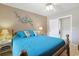 Comfortable bedroom showcasing a queen bed with a patterned wall decoration at 412 43Rd Ave. N, Myrtle Beach, SC 29577