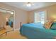 Comfortable bedroom with a queen bed, mirrored closet doors and sunlit window at 412 43Rd Ave. N, Myrtle Beach, SC 29577
