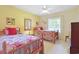 Bright bedroom featuring twin beds with colorful bedding and a vintage mirror at 412 43Rd Ave. N, Myrtle Beach, SC 29577